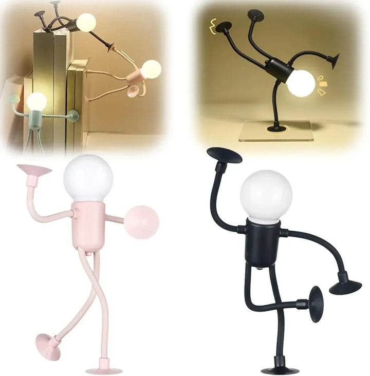 Pink and black figure lights standing in poses, above photos of other figures on books and a glass base 13