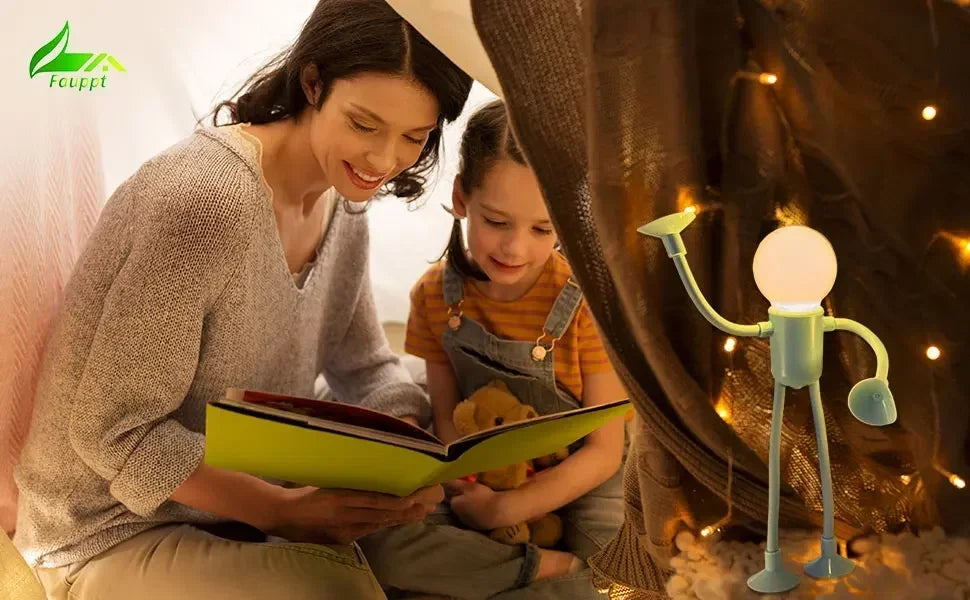 Mother and daughter reading a picture book while a mint figure light glows beside them 18