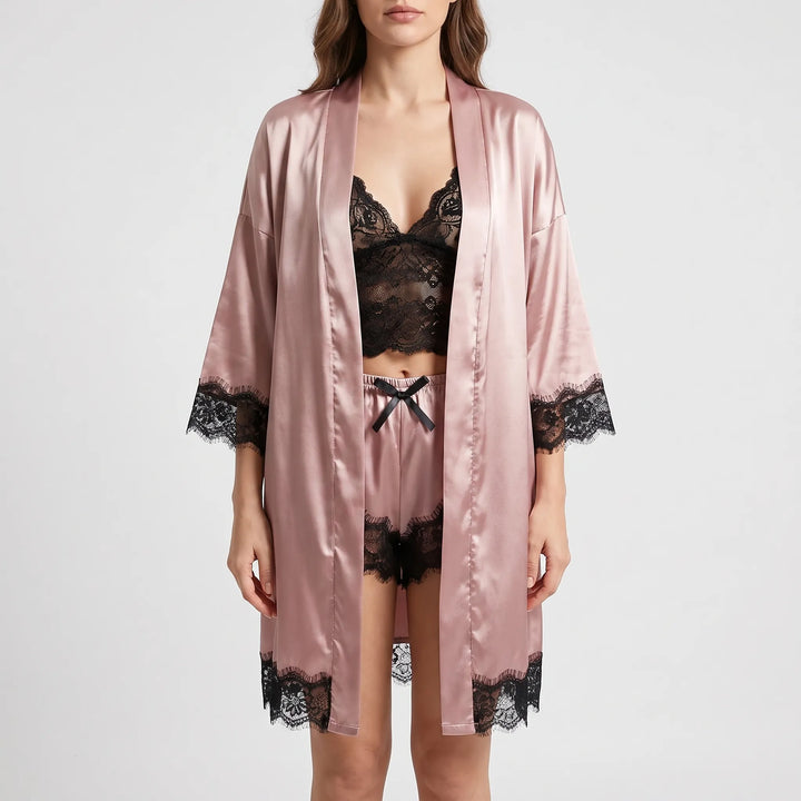 Front view of the pink satin set worn with the robe open over a black lace bralette and bow-front shorts. 5