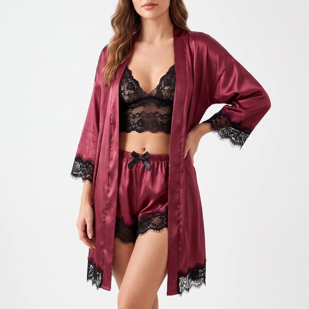 Model in the burgundy satin set with the robe open, black lace bralette and shorts with a small black bow. 7