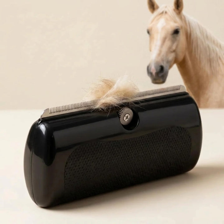 Black handheld horse grooming brush with a steel toothed edge and a tuft of pale horse hair.