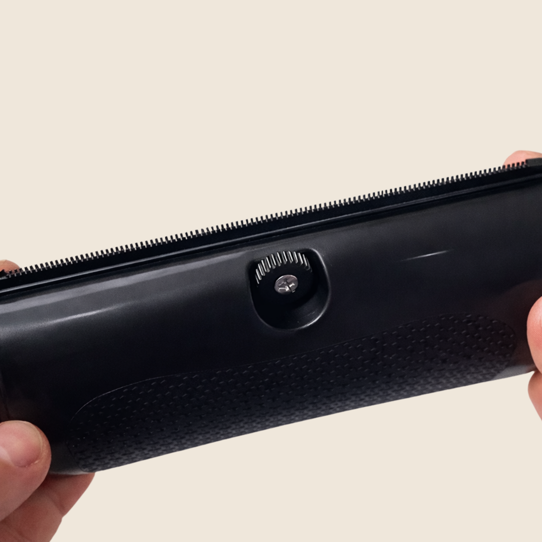 Another view of the brush showing the knurled adjustment screw, fine teeth and grip pattern.