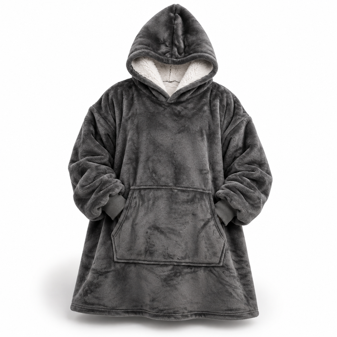 Grey oversized hoodie blanket shown flat from the front, with a white sherpa-lined hood, ribbed cuffs and a large front pocket.