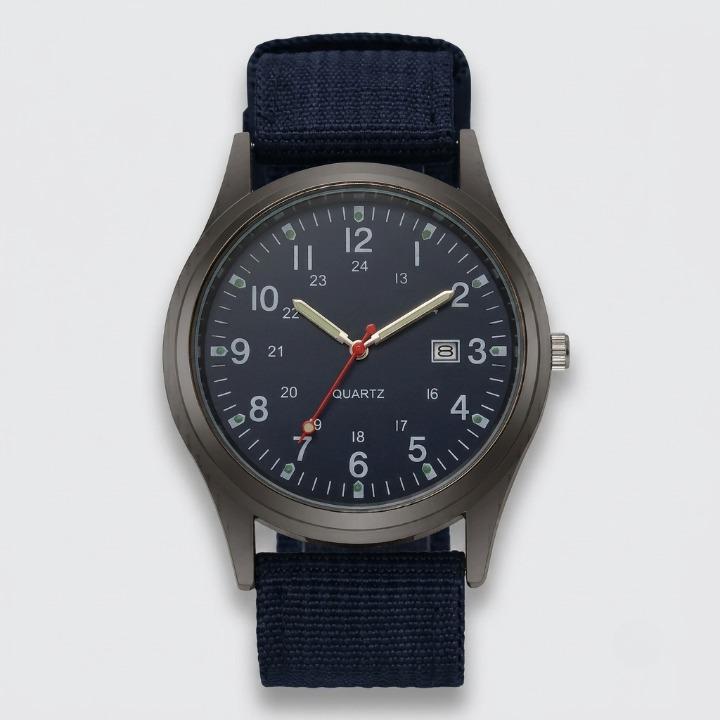 Navy blue military watch with nylon strap, front view on a light background, showing the blue dial and dark blue strap.
