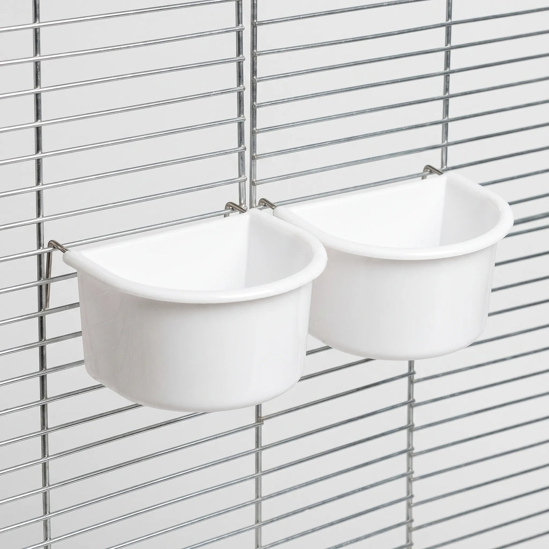 Two white half-round bowls hung on cage bars by thin metal wire hooks, shown at a slight angle. 7