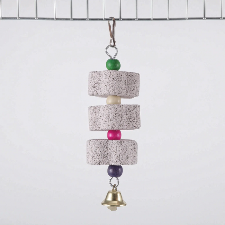 Three-block version clipped to a cage wire, with round gray stone blocks separated by green, cream, pink and purple beads, and a bell. 7