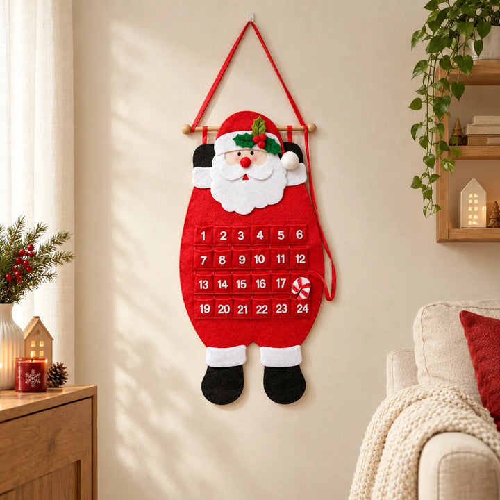 Red felt Santa calendar with 24 numbered pockets hanging on a cream wall in a cozy living room with holiday decor. 1