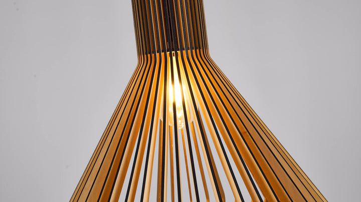 Detail of the lit bulb inside a slatted wooden pendant lamp with vertical wood strips and a narrow neck