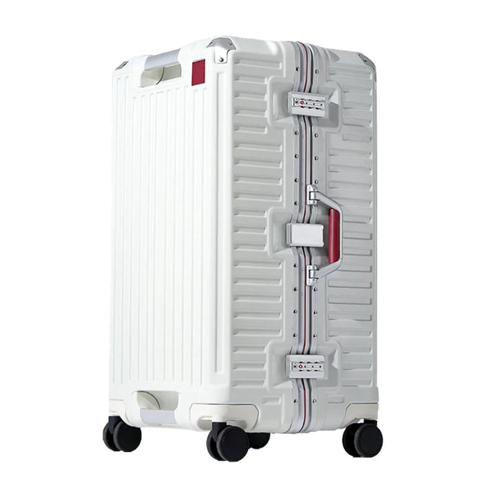 White ribbed hardshell suitcase with silver aluminum frame, red-accented side handle, two combination locks and four spinner wheels.