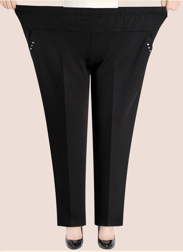 Schwarze Damenhose mit elastischem Bund, seitlichen Reißverschlusstaschen, bequem, elegant.