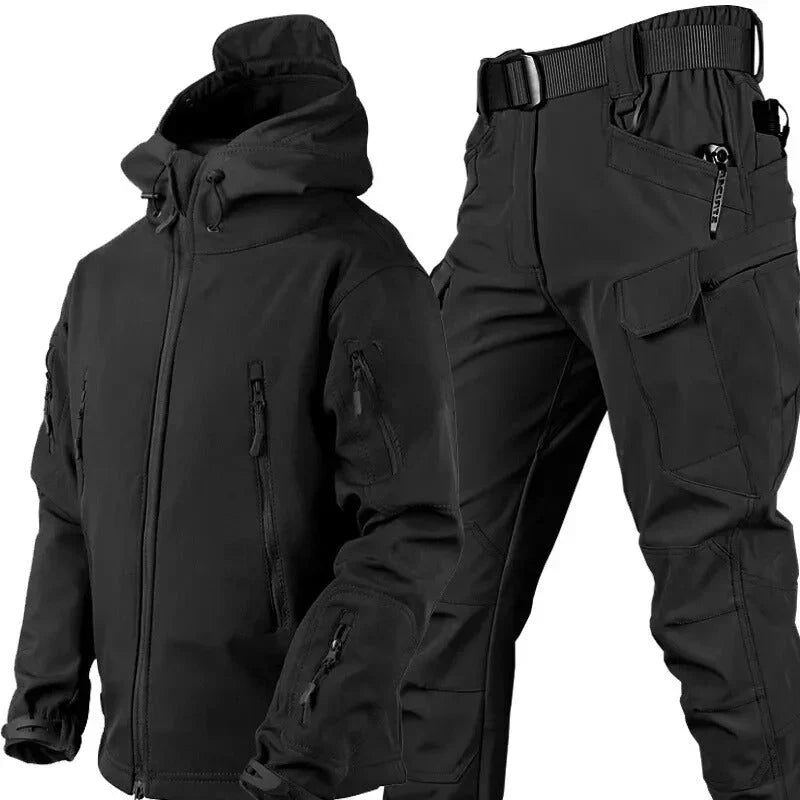 Black hooded zip jacket with sleeve pockets beside matching cargo pants with belt, angled view 1