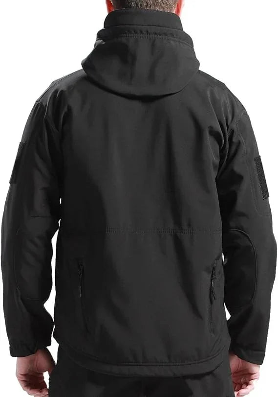 Back view of the black hooded jacket on a model, with sleeve patches and hem pockets 4