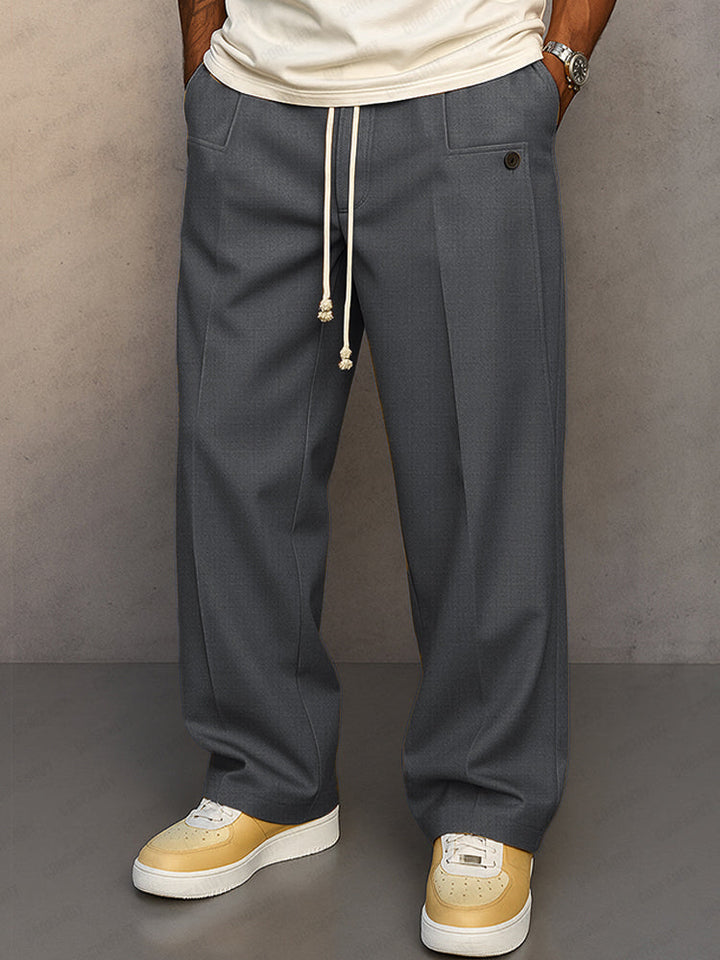 Men's grey relaxed fit pants, detail view.