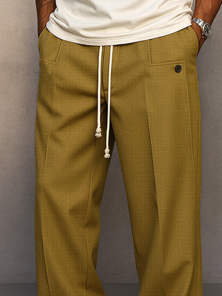 Men's grey relaxed fit pants, detail of the waistband.