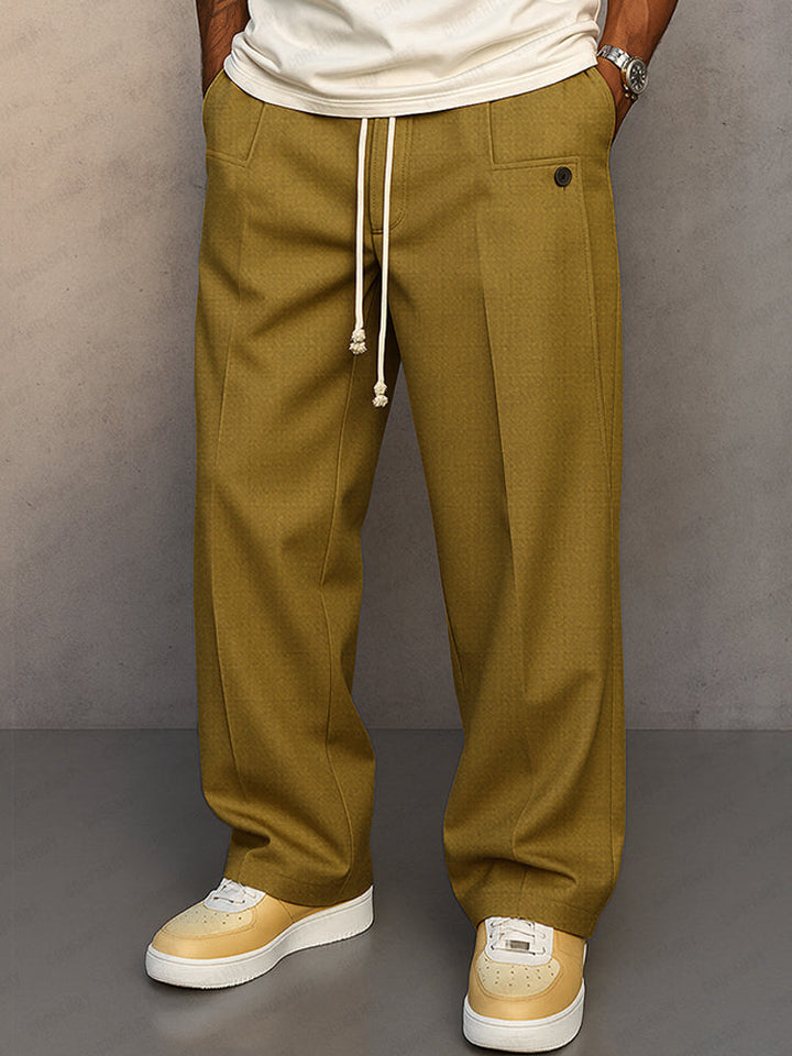 Men's grey relaxed fit pants on a model, front view.