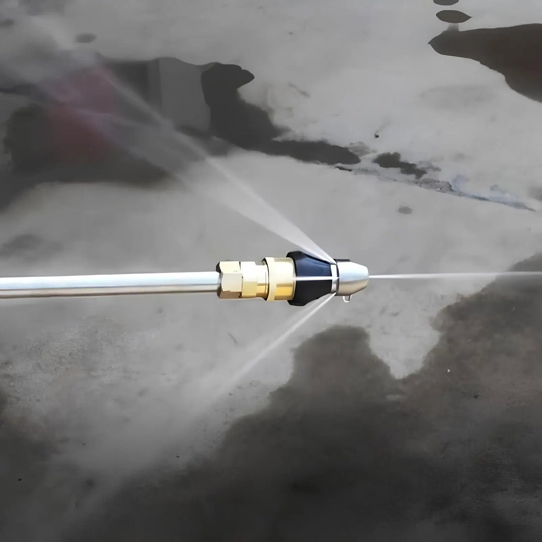 Another view of the nozzle on a metal lance spraying water jets forward and backward.