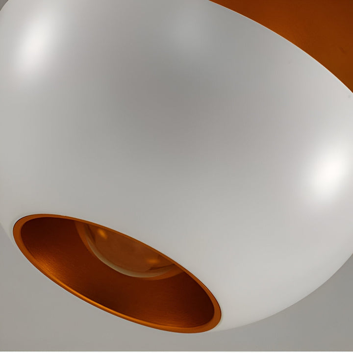AppleGlow Pendant Light in white metal with rounded surface and gold-lined opening.