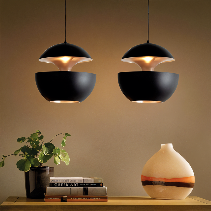 AppleGlow Pendant Light in black metal glowing warmly, another view.
