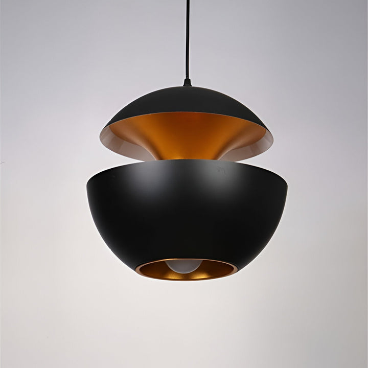 AppleGlow Pendant Light in black metal with split dome shell, gold interior and a black cord.