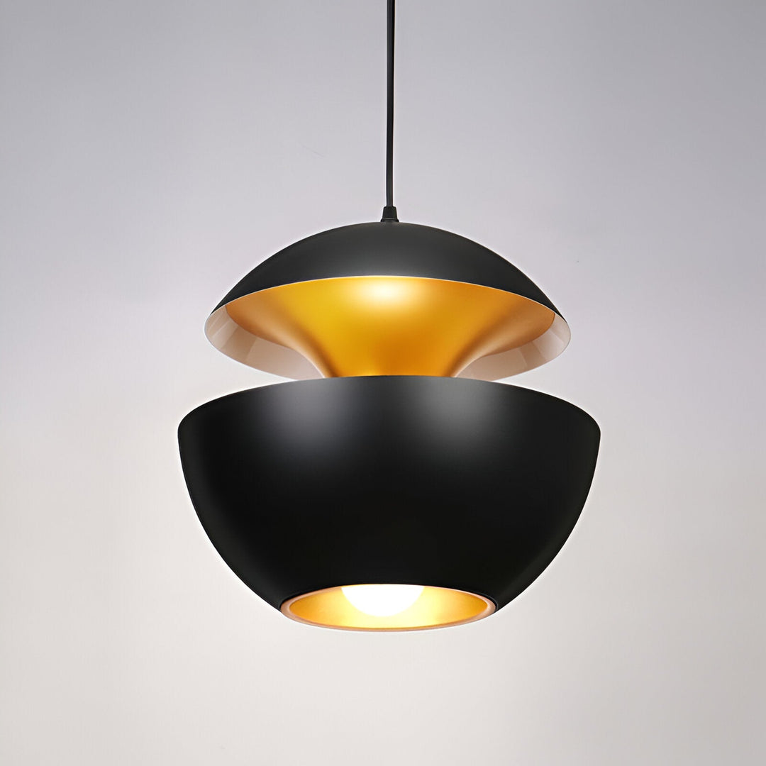 AppleGlow Pendant Light in black metal with glowing gold interior and a bright bulb.