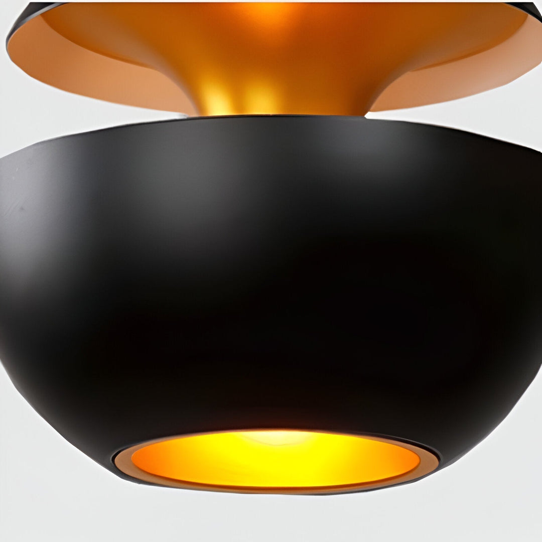 AppleGlow Pendant Light detail of the black lower bowl glowing gold at its opening.