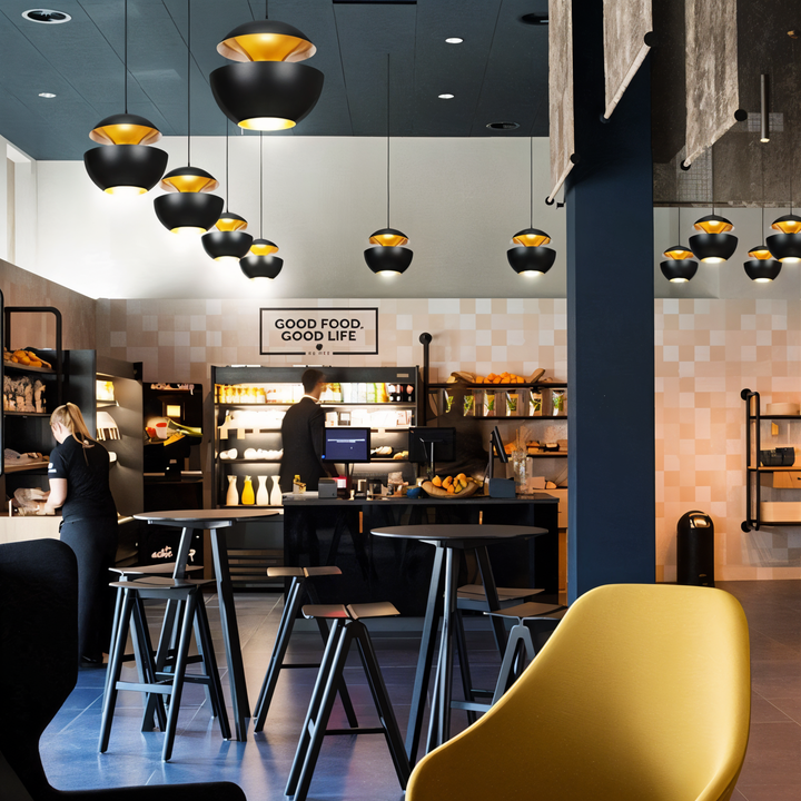 AppleGlow Pendant Light in black metal with gold interiors, another view.