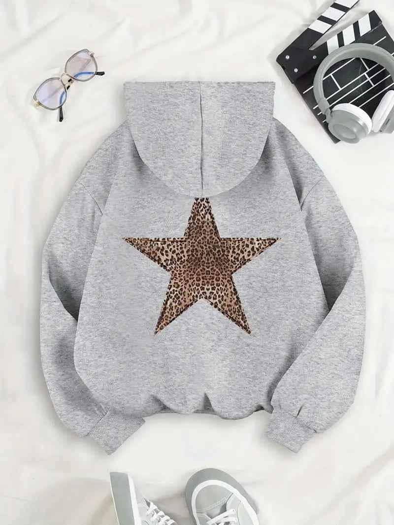 Flat lay of the heather gray hoodie from behind, showing the leopard-print star, with glasses, headphones and sneakers beside it. 2