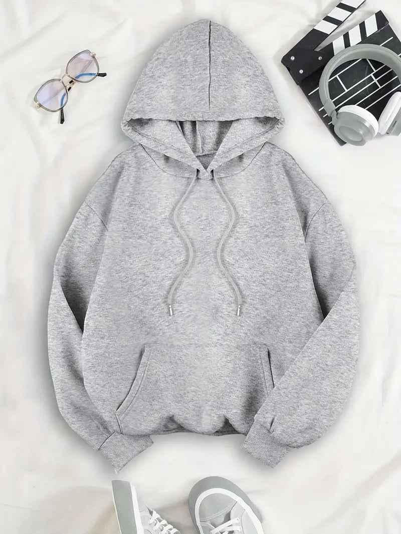 Flat lay of the gray hoodie from the front, showing the hood, drawstrings, kangaroo pocket and ribbed cuffs and hem. 4