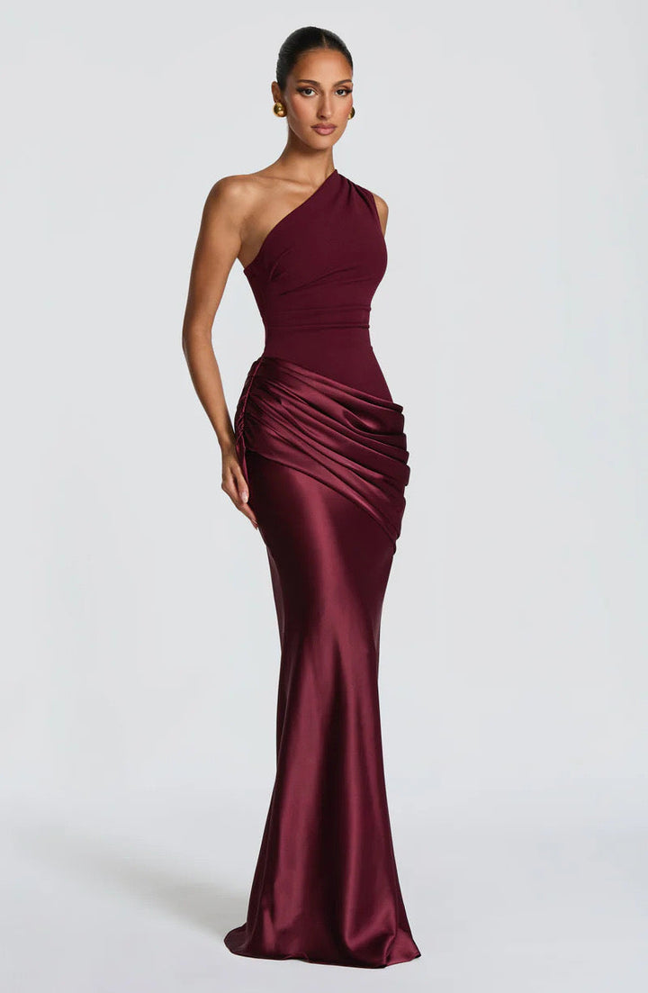 Sidonie One-Shoulder Draped Satin Maxi Dress in burgundy, another view showing the draped hip and satin skirt.