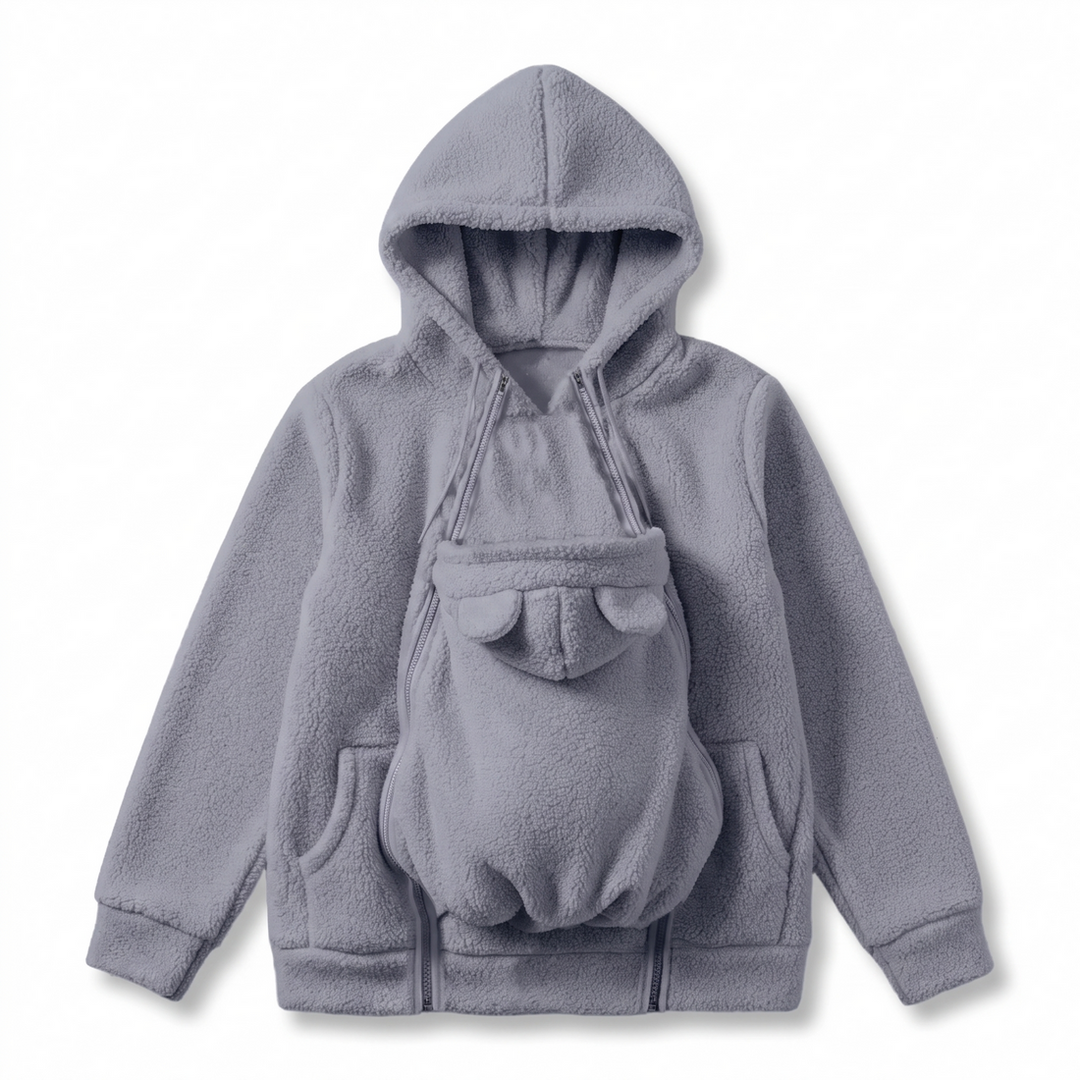 Gray fleece hoodie with the bear-eared baby pouch panel unzipped over the front.