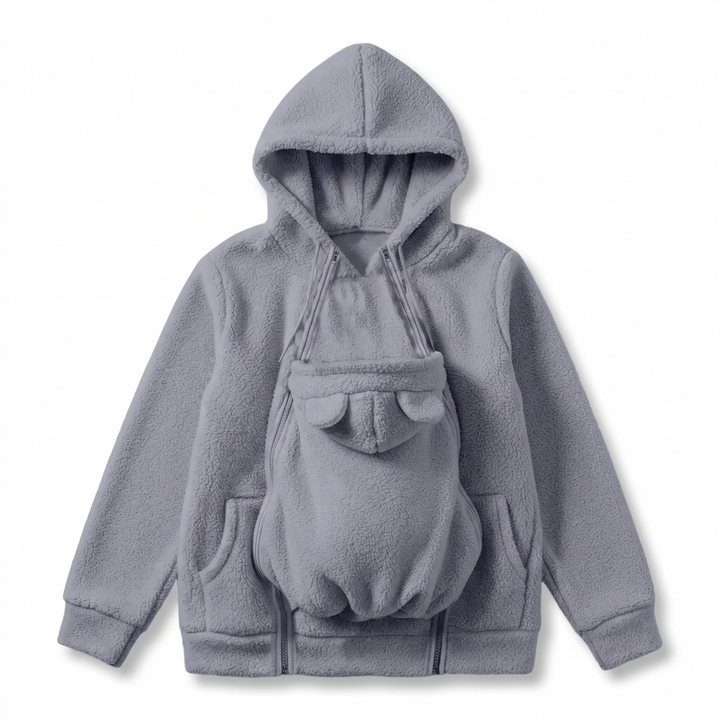 Gray sherpa fleece hoodie laid flat with the bear-eared zip-on carrier panel attached to the front.