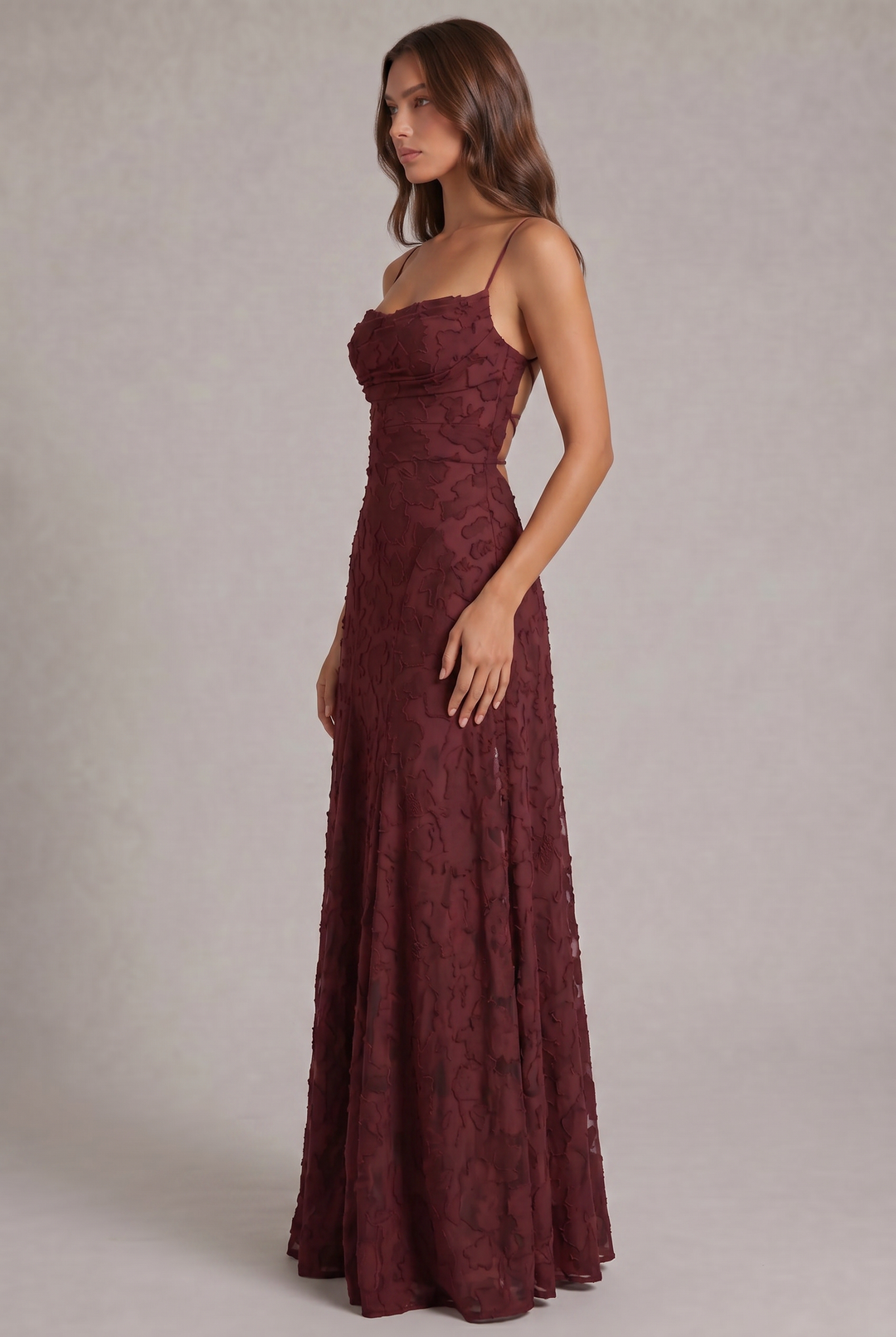 Olivia Maxi Dress in burgundy, side view with fitted bodice and flowing skirt