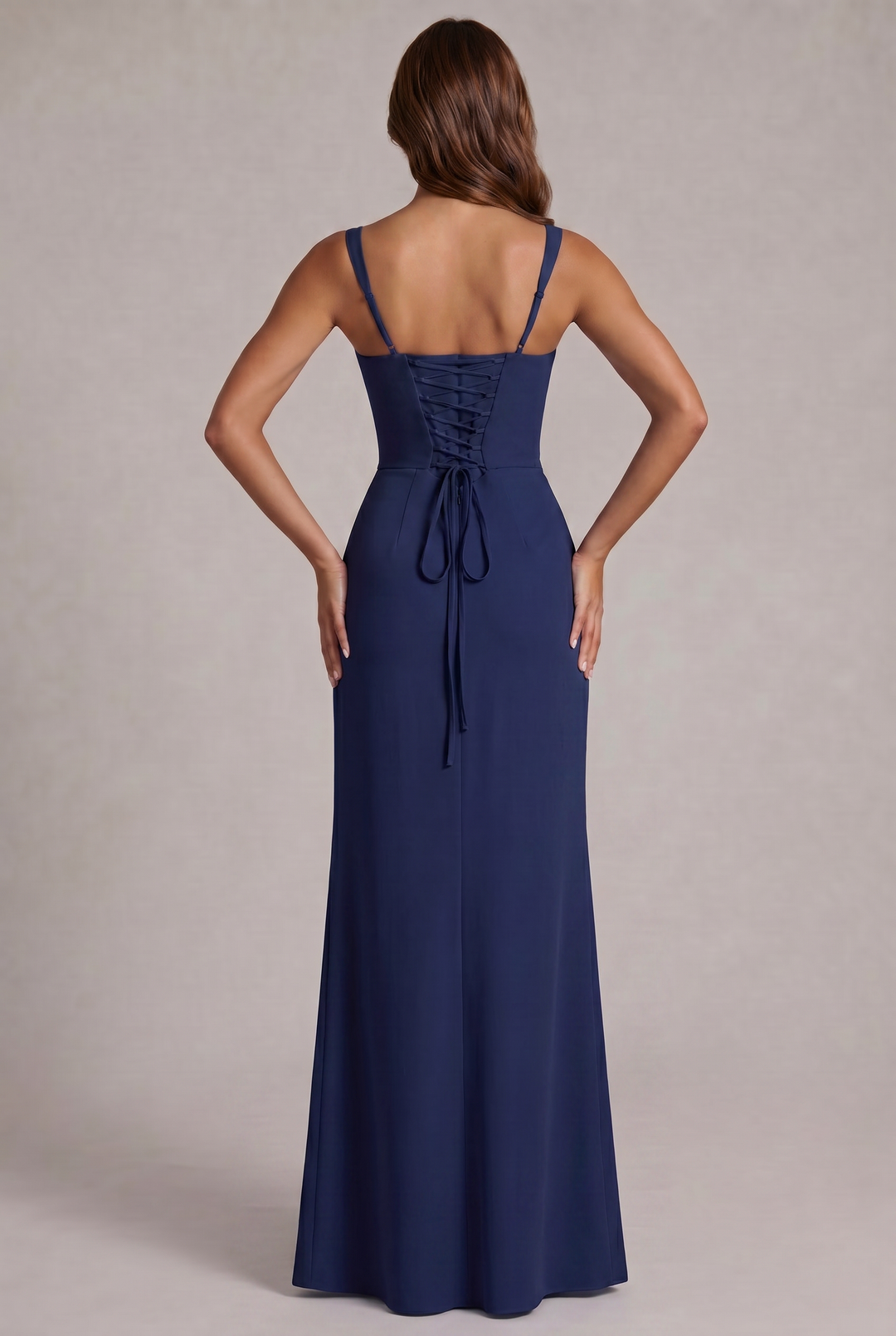 Back view of the navy dress on a model, showing the corset-style lace-up back and thin adjustable straps. 4