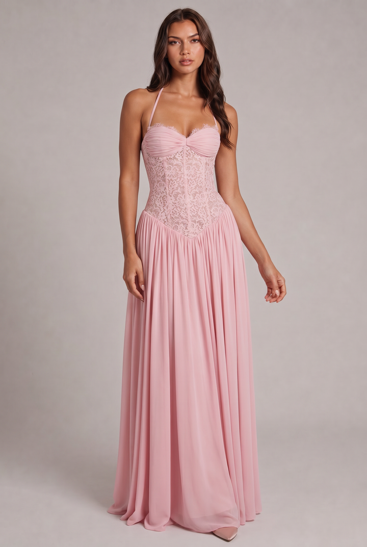 Model faces the camera in the green maxi dress, full length, showing the lace bodice and gathered skirt.
