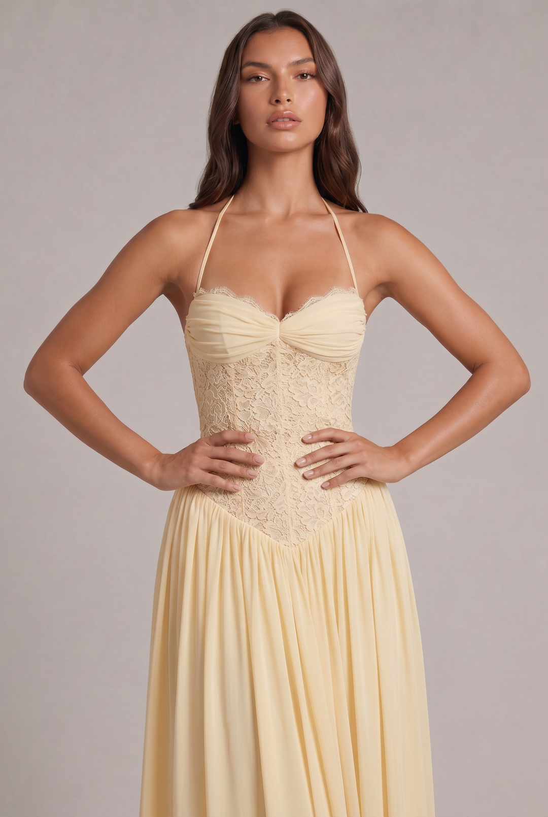 Close-up detail of the green bodice with ruched cups, lace corset panels and a V-shaped waist.