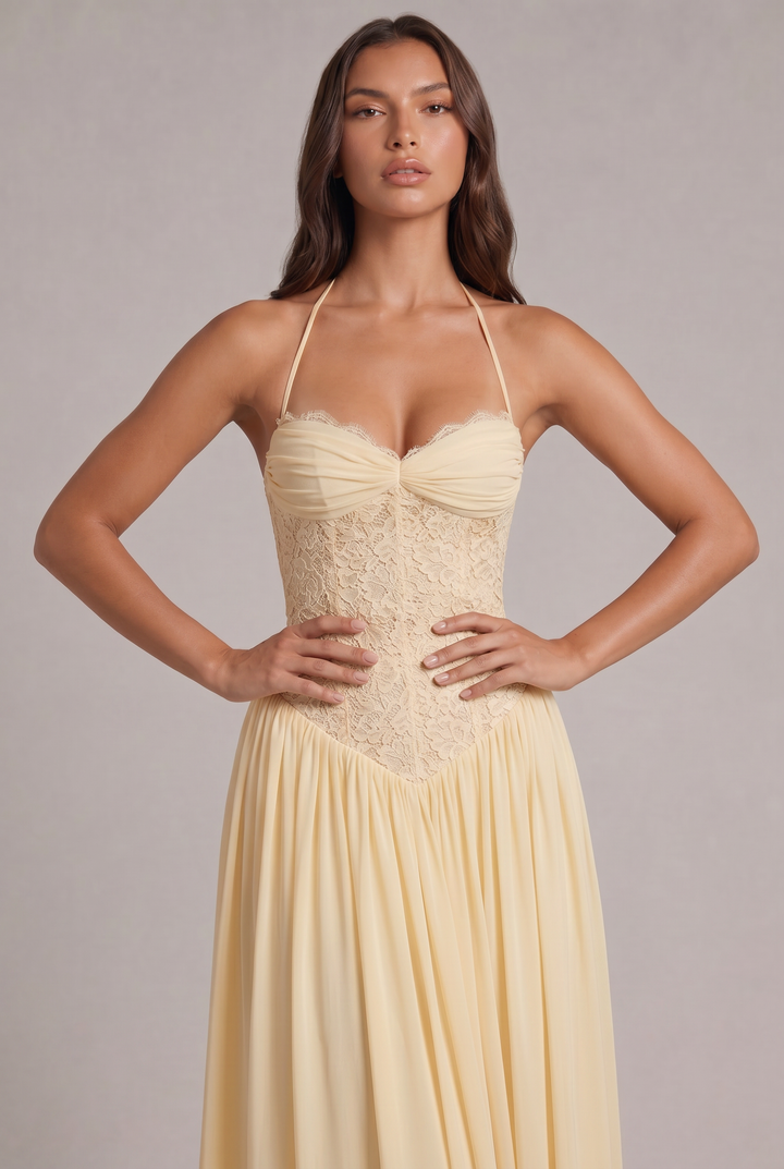 Close-up detail of the green bodice with ruched cups, lace corset panels and a V-shaped waist.
