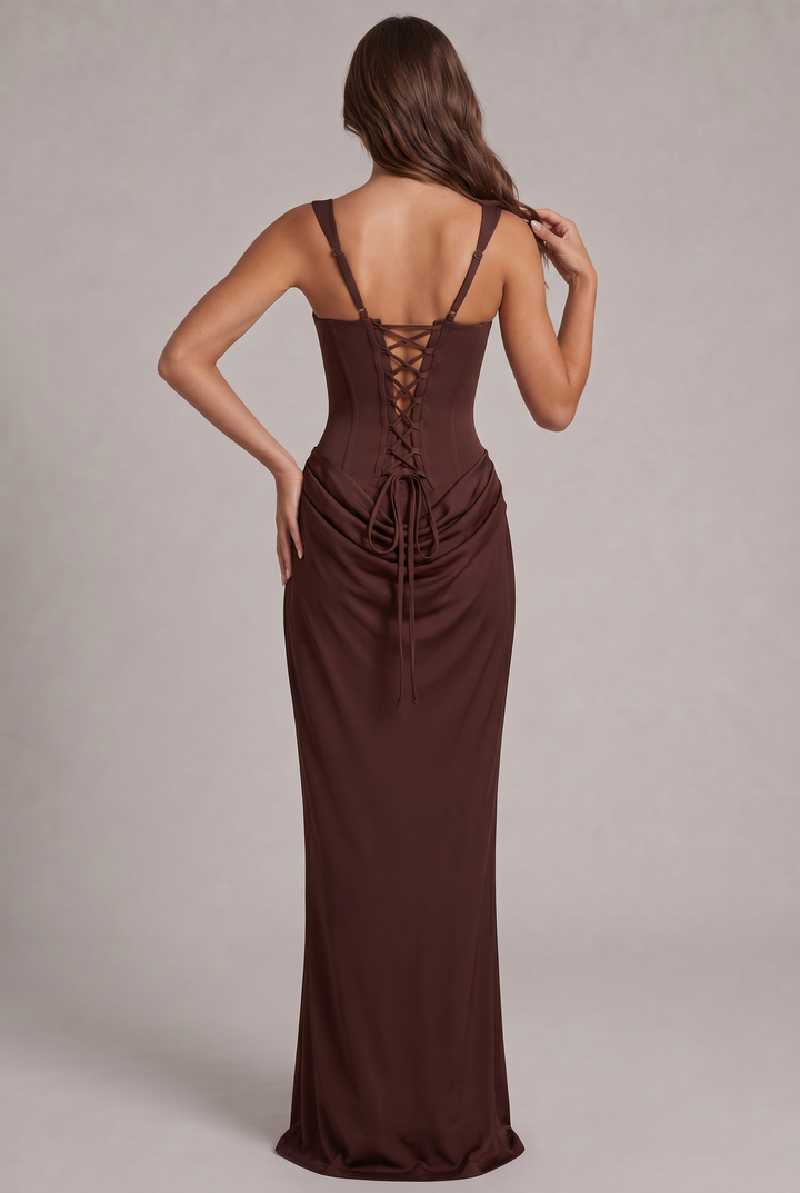 Another view of the black dress with lace-up corset back, adjustable straps and long ties over the draped skirt.