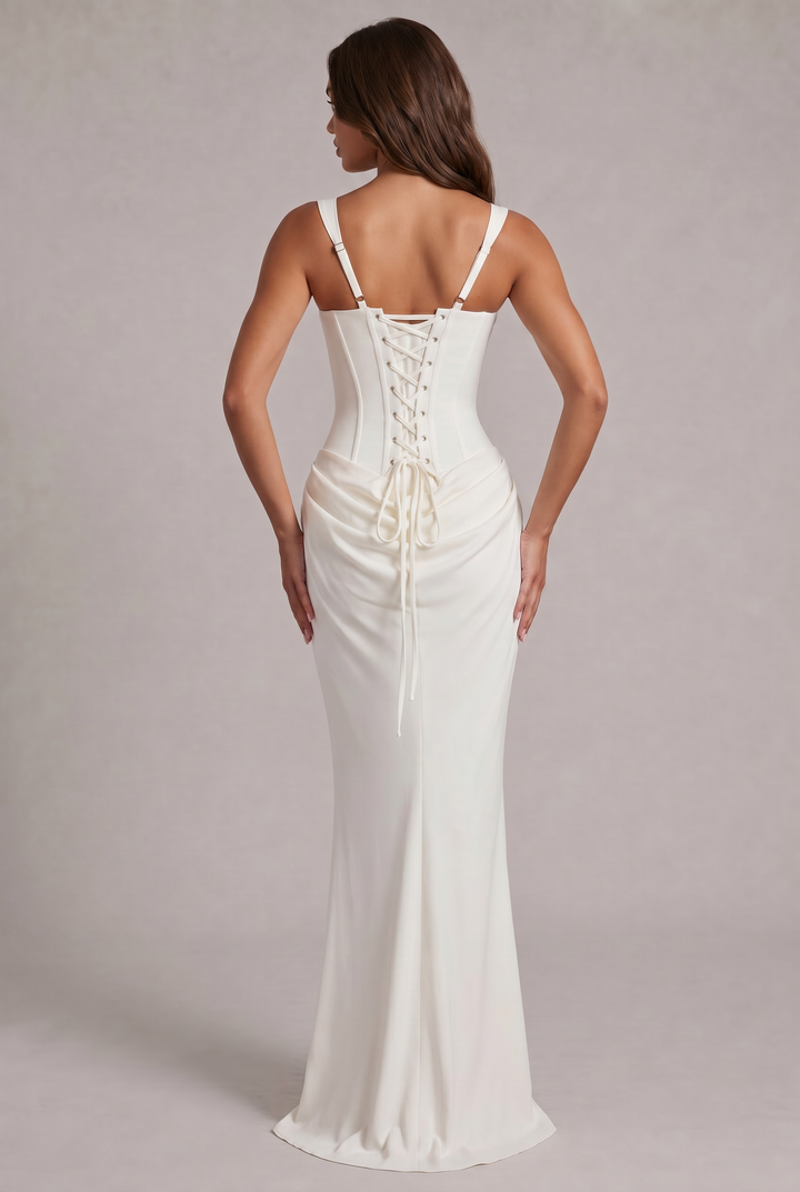 Another view of the white dress showing the lace-up corset back with metal eyelets, adjustable straps and trailing ties.