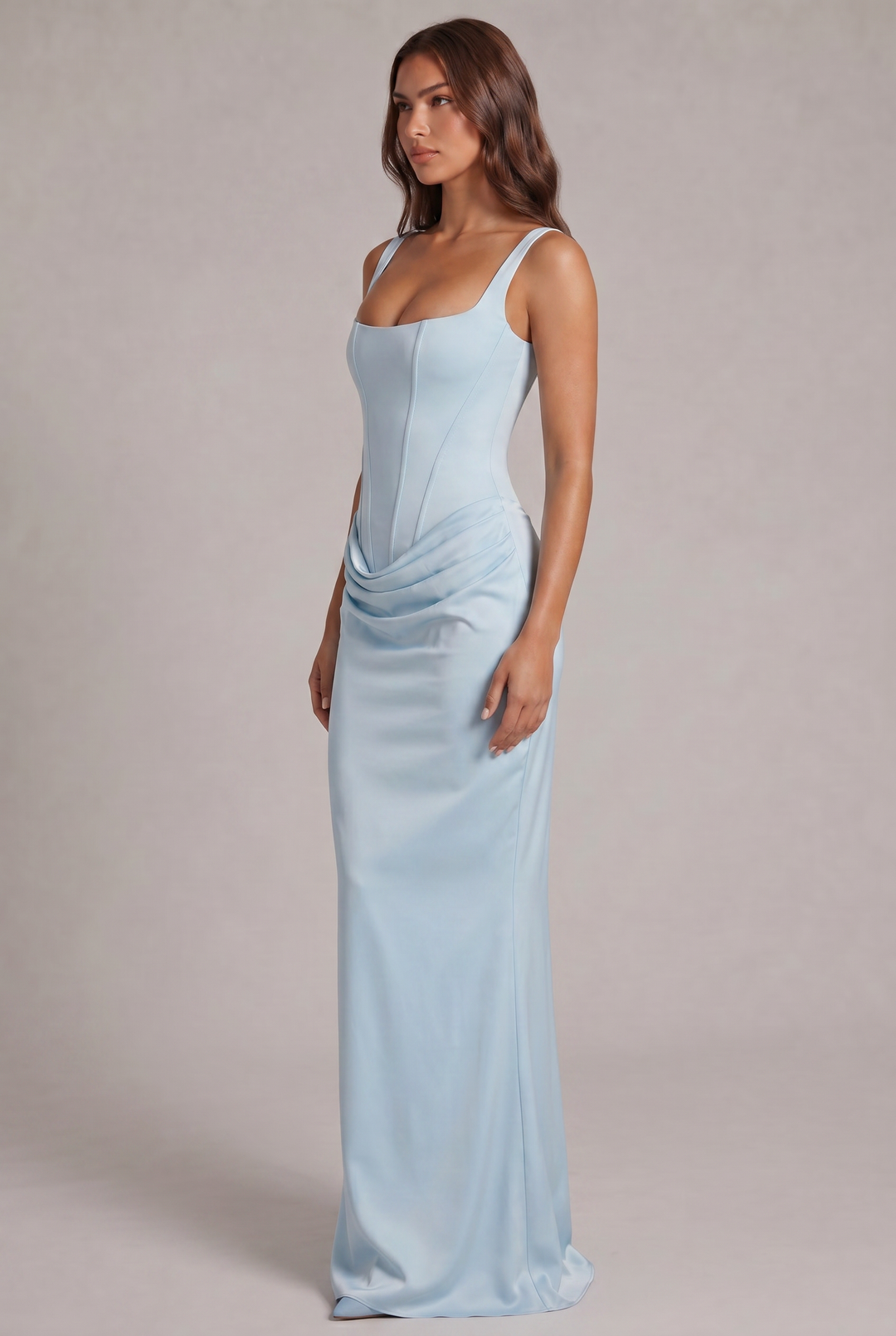 Another view of the light blue maxi dress showing the draped hip detail and straight skirt.