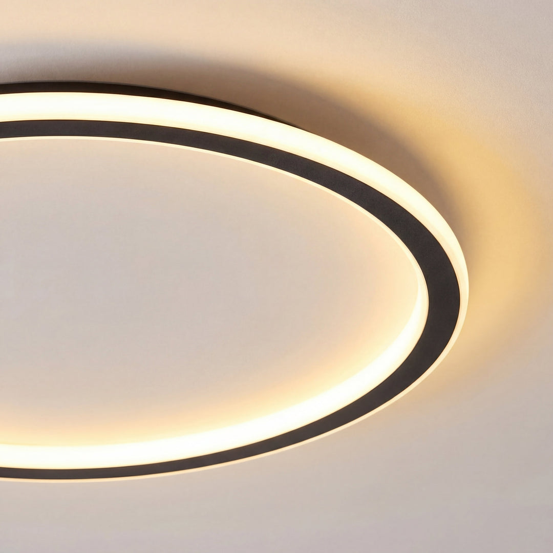 Close-up detail of the glowing ring and slim black frame edge, showing the soft warm light spreading onto the ceiling. 2
