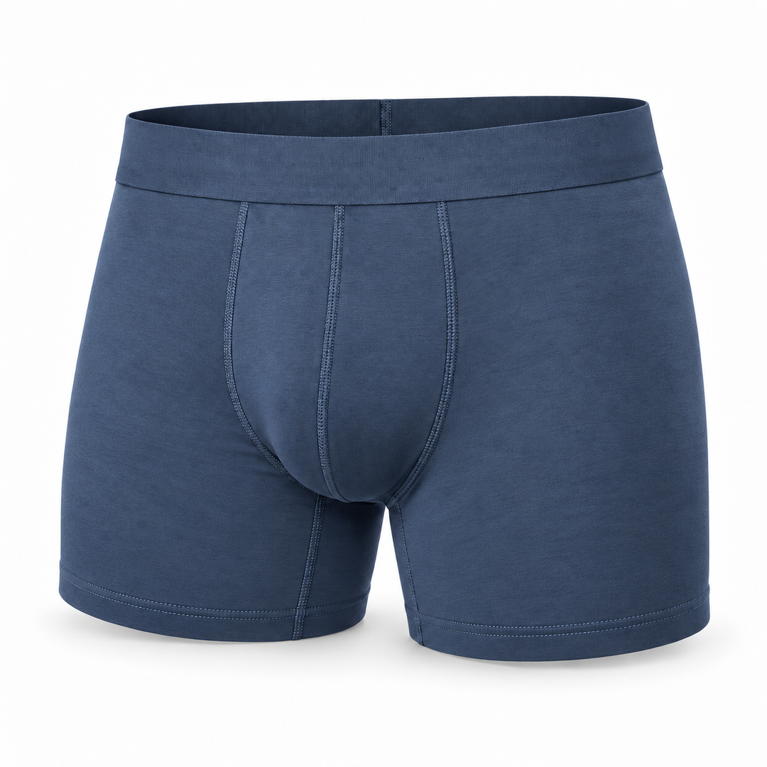 Single steel-blue boxer brief shown from the front, with wide waistband, stitched pouch seams and longer leg. 9