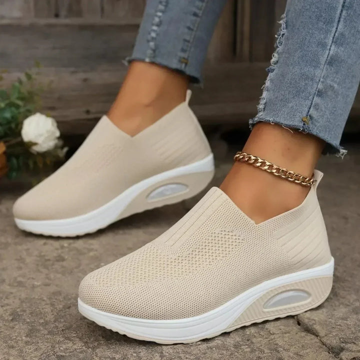 Beige breathable knit slip-on sneakers with white platform soles, another view