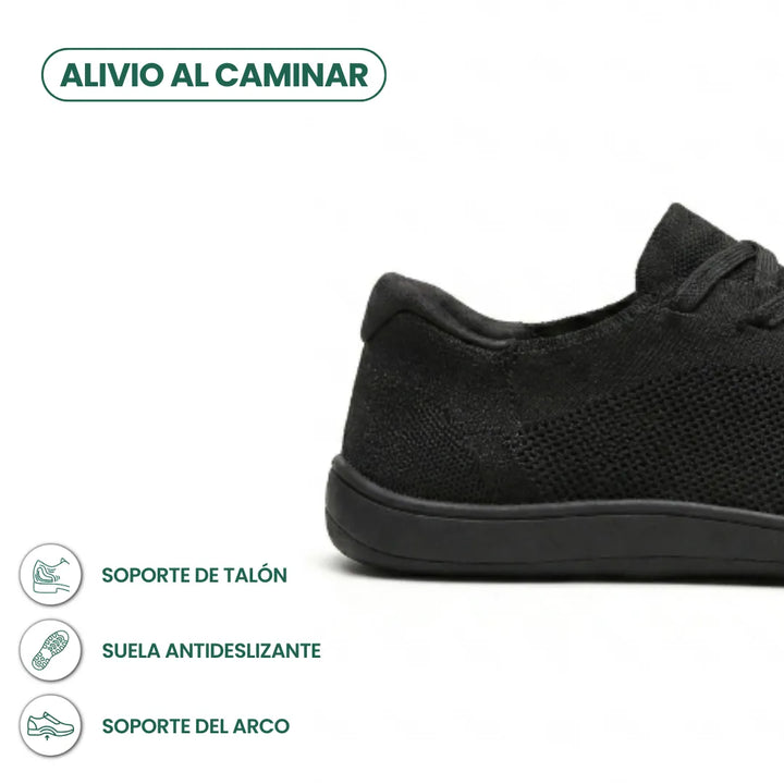 Close-up detail of the heel of a black sneaker with callouts for heel support, non-slip sole and arch support.