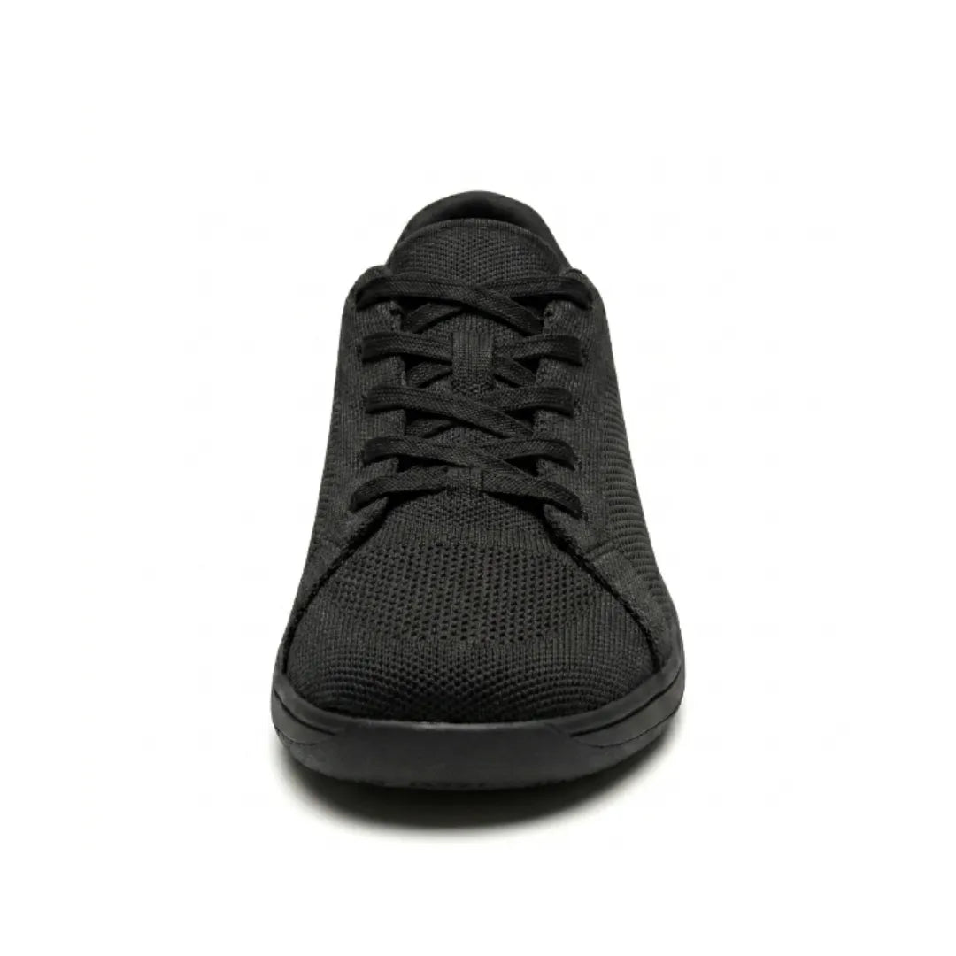 Front view of a black knit sneaker showing the criss-cross laces, rounded toe box and flat black sole.