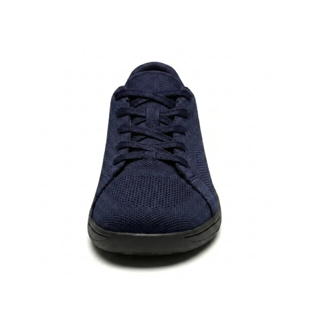 Front view of a navy blue knit sneaker with black sole, showing the crossed laces and rounded toe box. 26