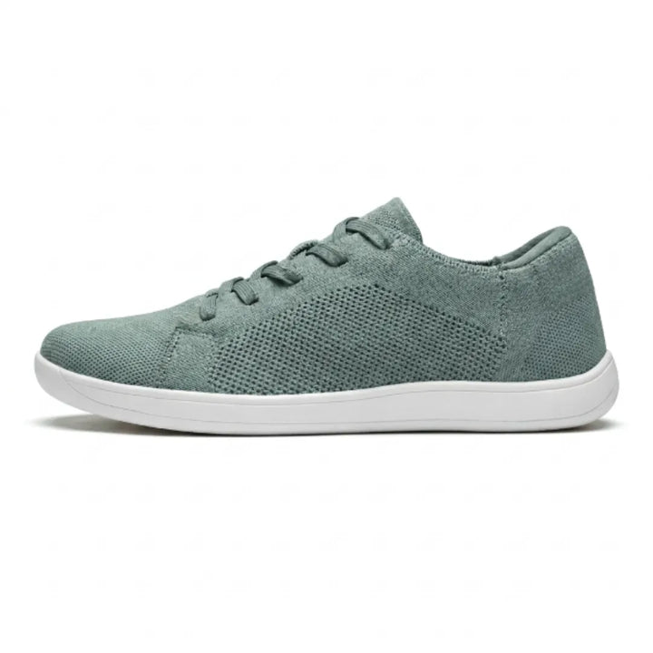 Side view of a single sage green knit sneaker with white sole, mesh panel and elastic-style laces. 28