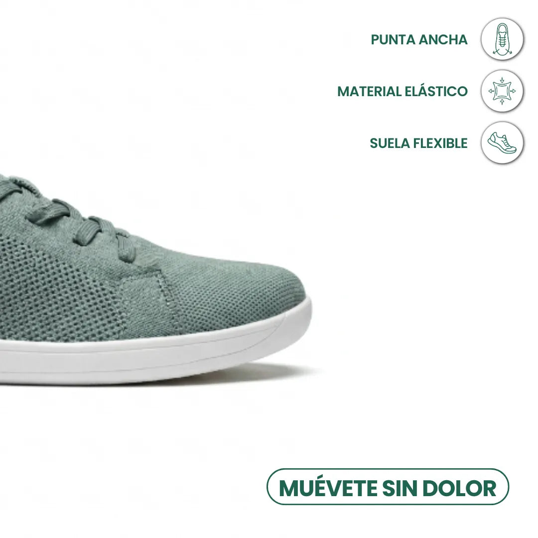 Close-up of the wide toe area of a sage green knit sneaker with white sole, with icons about flexibility and toe room. 32