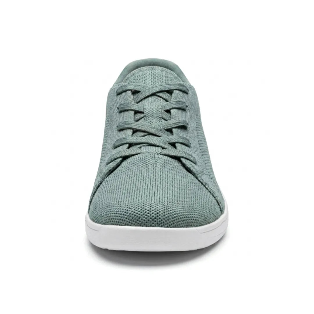 Front view of a sage green knit sneaker with white sole, showing the crossed laces and rounded toe box. 35