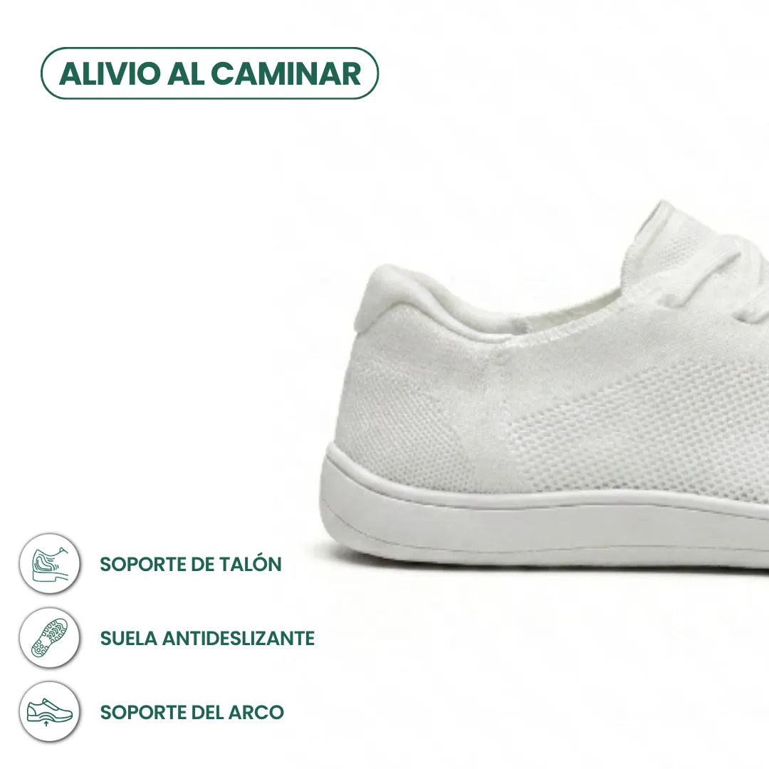 Close-up of the heel of an all-white knit sneaker with white sole, with icons about heel support, grip and arch support. 40