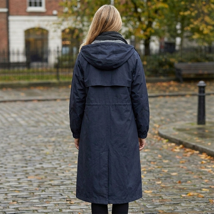 Women's Raincoat in navy blue, back view showing the hood, back yoke and center vent.